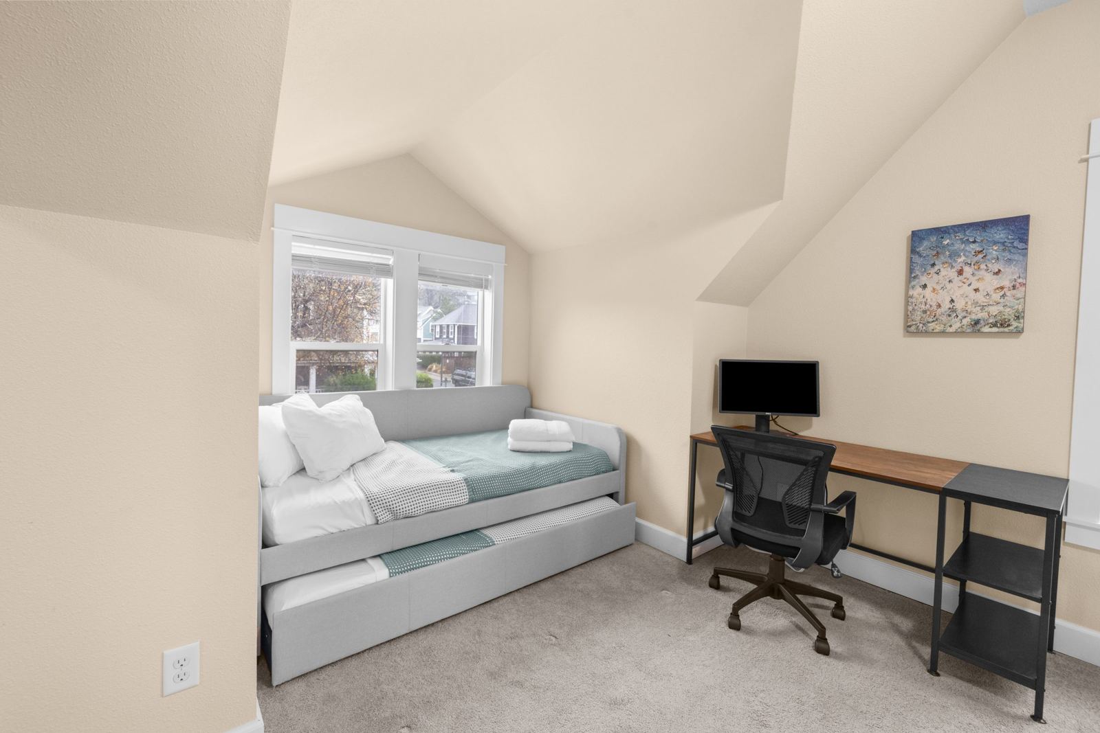 Upstairs bedroom with daybed trundle and desk