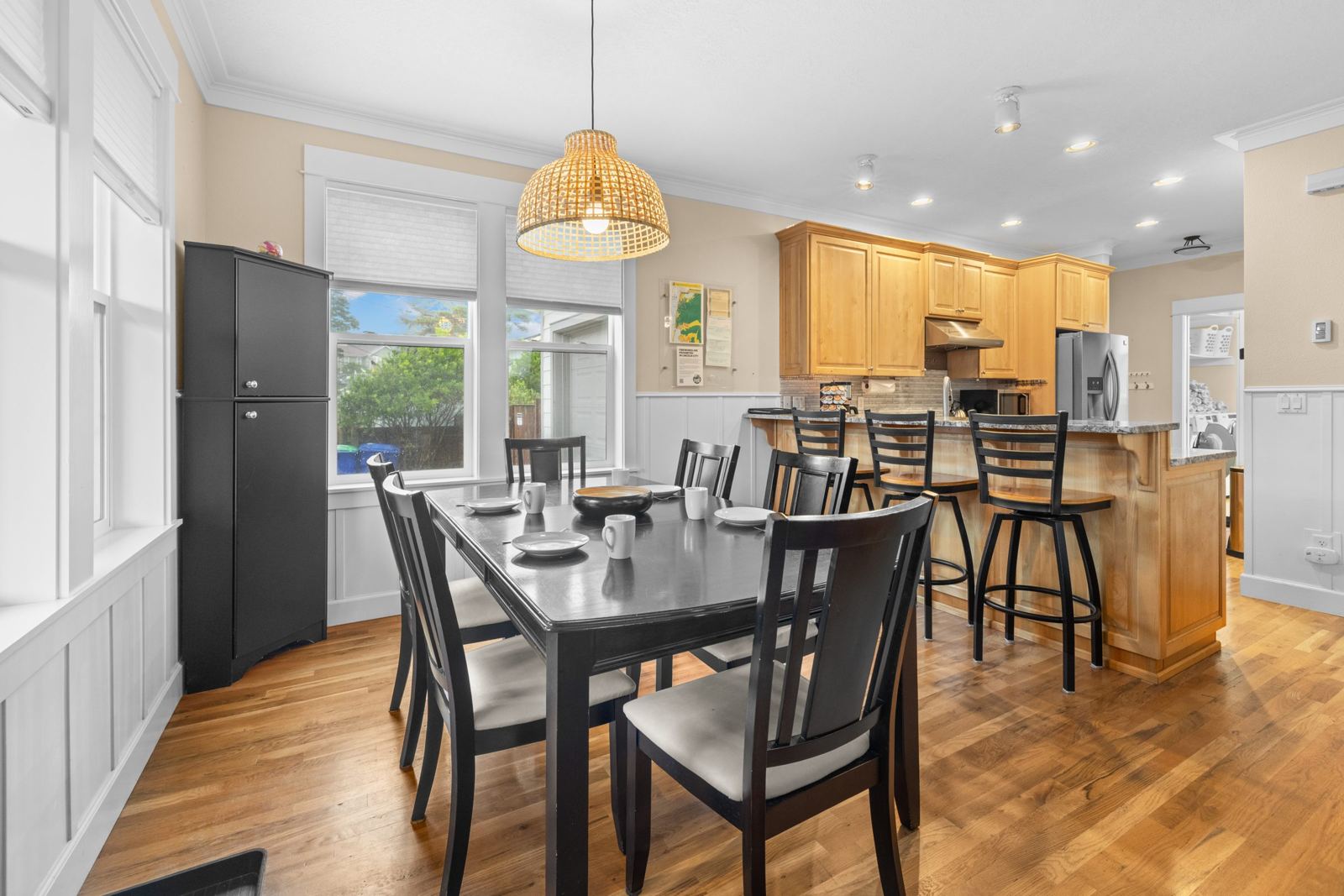 Dining table for six with island seating behind